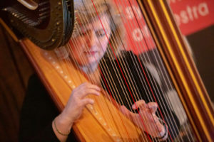 Woman playing the harp