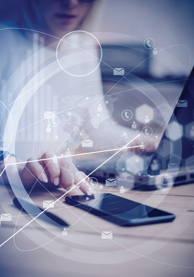 It’s Upgrade Time Concept of virtual interfaces,digital icons,worldwide online connections.Female hand touching black screen modern smartphone on the wooden table.Young business people using mobile devices.Blurred