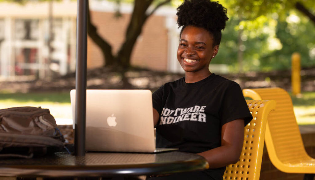 Elisabeth Petit-Bois, a Kennesaw State University software engineering student who will complete an internship at CERN this summer, poses outside of the Atrium Building on the Marietta Campus on May 14, 2019.