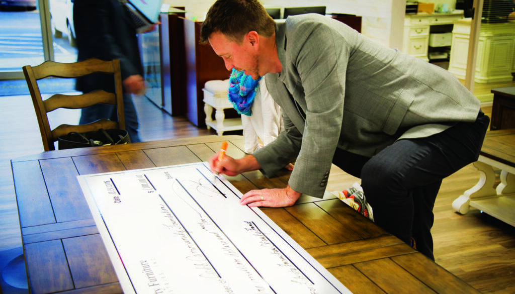 business - JB signing check
