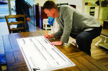 business - JB signing check