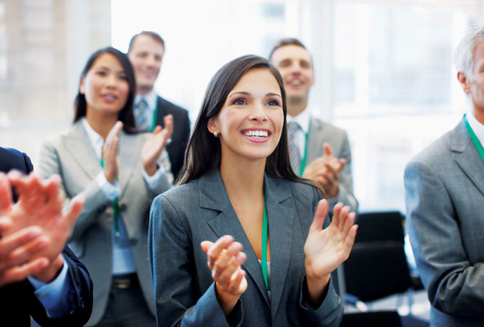 Women of Achievement Business people clapping in seminar