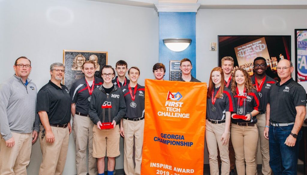 MPCS carbon fiber with banner and head of school