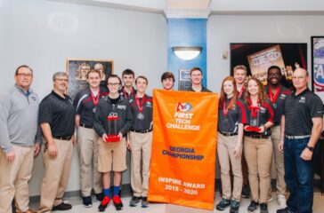 MPCS carbon fiber with banner and head of school