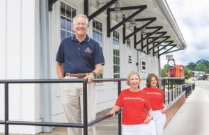 Growing Up Acworth Acworth Mayor Tommy Allegood with Kim Wigington (center), chairperson, Acworth Downtown Development Authority; and Malinda Howe, chairperson, Acworth Tourism Bureau Authority. Photos: LaRuche Creative