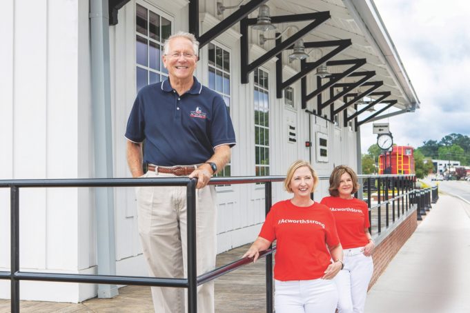 Growing Up Acworth Acworth Mayor Tommy Allegood with Kim Wigington (center), chairperson, Acworth Downtown Development Authority; and Malinda Howe, chairperson, Acworth Tourism Bureau Authority. Photos: LaRuche Creative