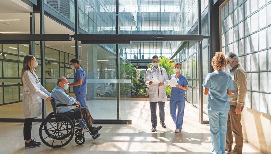 People walking in and out of the hospital - Healthcare concepts