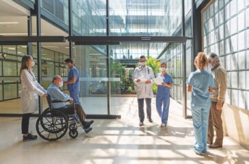 People walking in and out of the hospital - Healthcare concepts