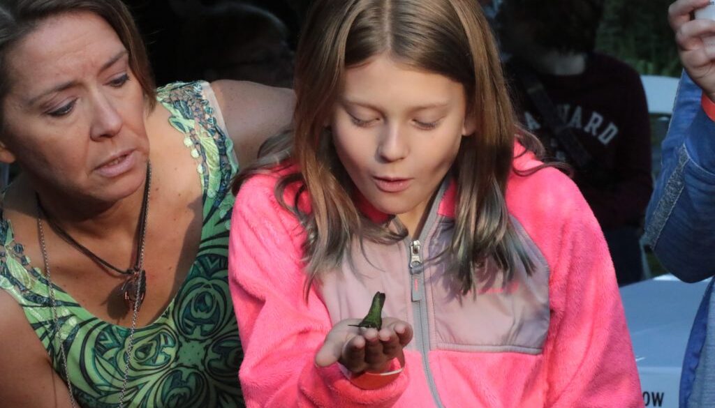 Mother and child exploring hummingbirds at Smith-Gilbert Gardens