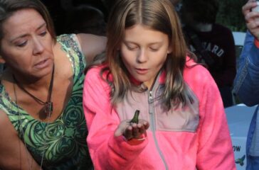 Mother and child exploring hummingbirds at Smith-Gilbert Gardens