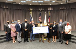 Too Important to Fail Cobb County Board of Commission members present grant funds to local business House of Heralds.