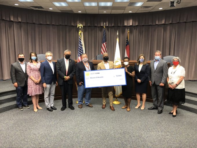 Too Important to Fail Cobb County Board of Commission members present grant funds to local business House of Heralds.