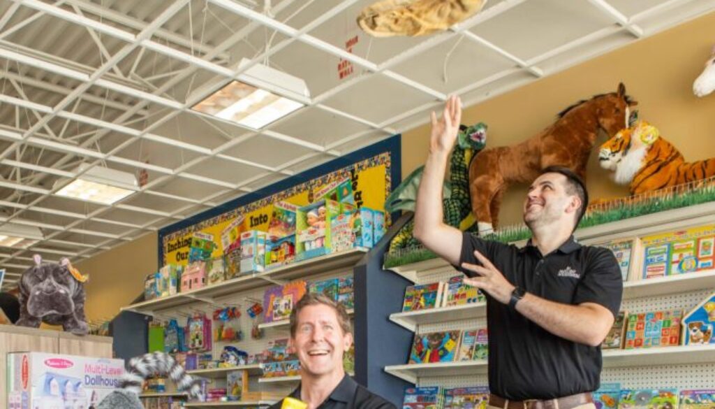 The School Box, Inc. Founder Dave Persson (seated) and Thomas Sherrer, operator of Mellow Mushroom in Kennesaw.