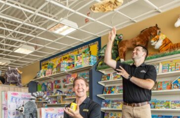 The School Box, Inc. Founder Dave Persson (seated) and Thomas Sherrer, operator of Mellow Mushroom in Kennesaw.