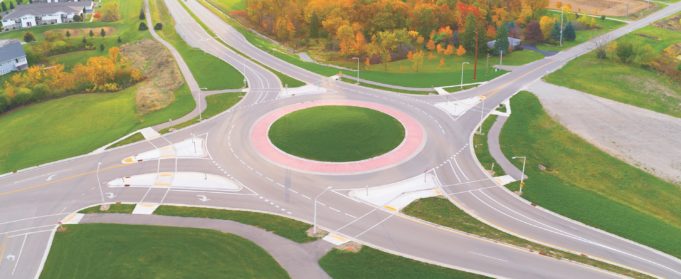 Roundabouts Aerial view of roundabout intersection at first light, with Autumn trees.