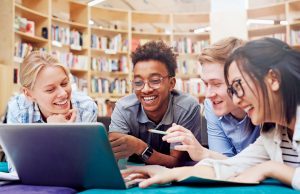 Libraries Are A ‘Gateway For A High Quality Of Life’ Students watching curious video on laptop
