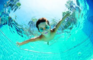 Swimming Safety Underwater Young Boy Fun in the Swimming Pool with Goggles