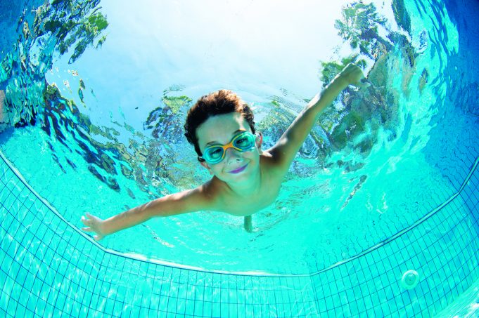 Swimming Safety Underwater Young Boy Fun in the Swimming Pool with Goggles