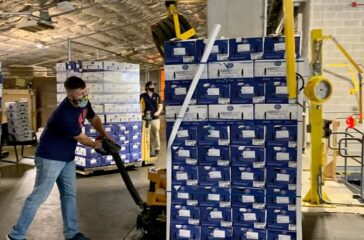Tyler Holley of the Atlanta Braves Foundation unloading food for the Fleet to be refrigerated prior to pick-up at Truist Park.