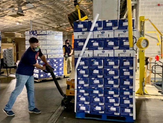 Cobb Community Food Fleet Comes to an End Tyler Holley of the Atlanta Braves Foundation unloading food for the Fleet to be refrigerated prior to pick-up at Truist Park.