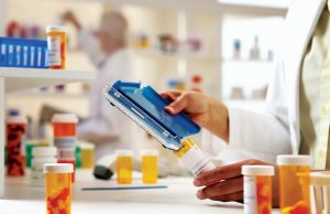 A Vital Community Service Pharmacist filling Prescription