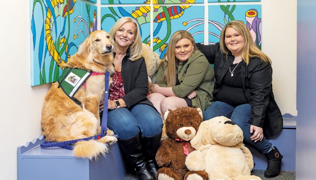 Left to right: SafePath Community Service Dog, Glinda; Investigator Monika Franklin; Hannah Schiltz; and Sarah Schiltz.