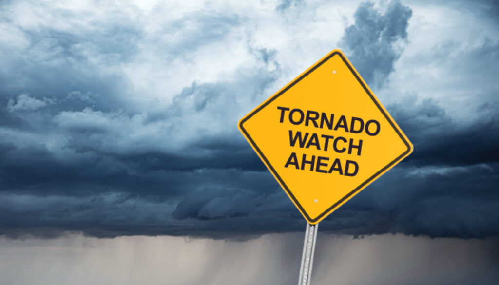 road sign that reads "tornado watch ahead."