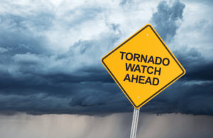 Tornado Safety Tips road sign that reads "tornado watch ahead."