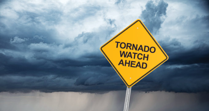 Tornado Safety Tips road sign that reads "tornado watch ahead."