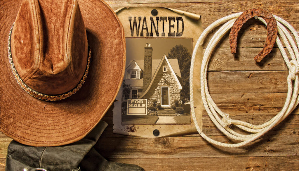 Very rusty old horseshoe symbol of luck and lasso hanging on a wooden wall cowboy hat and boots and blank sheet of paper with place for text