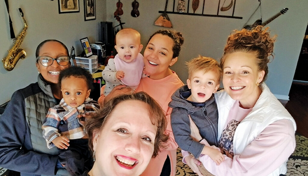 Gift of Music Foundation’s Lauren McBride with participants in one of the Foundation’s baby classes.