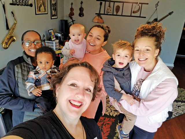 Gift of Music Foundation’s Lauren McBride with participants in one of the Foundation’s baby classes.