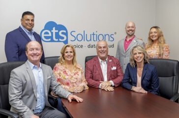 Pictured left to right: Managing Partner Thomas Collie III (seated), Client Experience Specialist Sal Thomas, Vice President Amy Russell, President Mike Russell, Technology Consultant Adam Clark, Client Development Manager Emily Snyder, and Strategic Advisor Kylah King (seated).