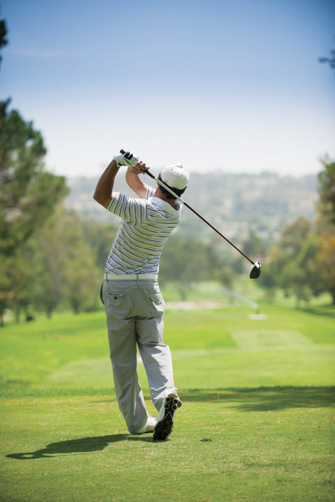 3rd Annual MBA Golf Tournament Tees Off On Oct. 20 A golfer at the end of his golf swing.