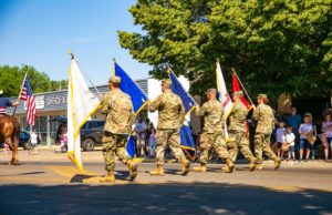 Cobb Events Honoring Military Veterans Soldiers marching in a Veteran's Day parade.