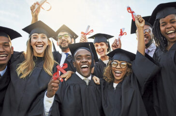 Shot of a group of cheerful university students on graduation day
