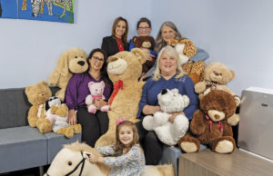 The Who, What, and Why Behind SafePath Children’s Advocacy Center Pictured L-R from the top: Claire Kirkland, LCSW, Director of Intervention Services; SafePath CEO Jinger Robins; Pam Martin, Director of Finance; Tiffany Webb, Director of Services; and Gail Garland, Director of Advocacy. The girl is not a client.