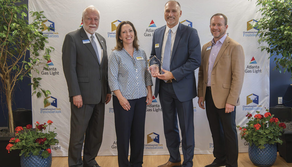 Yancey Brothers, 2024 SPARK Workforce Industry Partner of the Year. Shown here (L-R), are Dr. Ron Newcomb, Jennifer Kozel, Jim Larson (Yancey Brothers), and Board of Trustees Chair Rick Kollhoff.