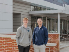Developing Future Leaders Ryan Moore, NCCS teacher and director of the Academy of Business, and Finley Ross, current UGA student and NCCS class of 2023 graduate PHOTO: LARUCHE PHOTO