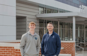 Developing Future Leaders Ryan Moore, NCCS teacher and director of the Academy of Business, and Finley Ross, current UGA student and NCCS class of 2023 graduate PHOTO: LARUCHE PHOTO