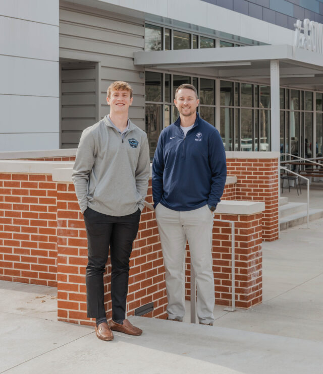 Ryan Moore, NCCS teacher and director of the Academy of Business, and Finley Ross, current UGA student and NCCS class of 2023 graduate PHOTO: LARUCHE PHOTO