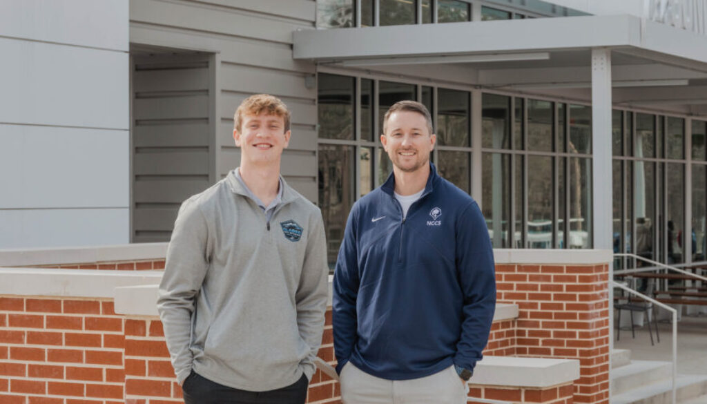 Ryan Moore, NCCS teacher and director of the Academy of Business, and Finley Ross, current UGA student and NCCS class of 2023 graduate PHOTO: LARUCHE PHOTO
