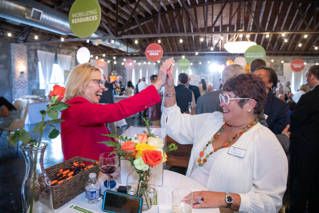 High five! CCF Board members Susan Tillery and Leana Kart at Activate Good 2026. 