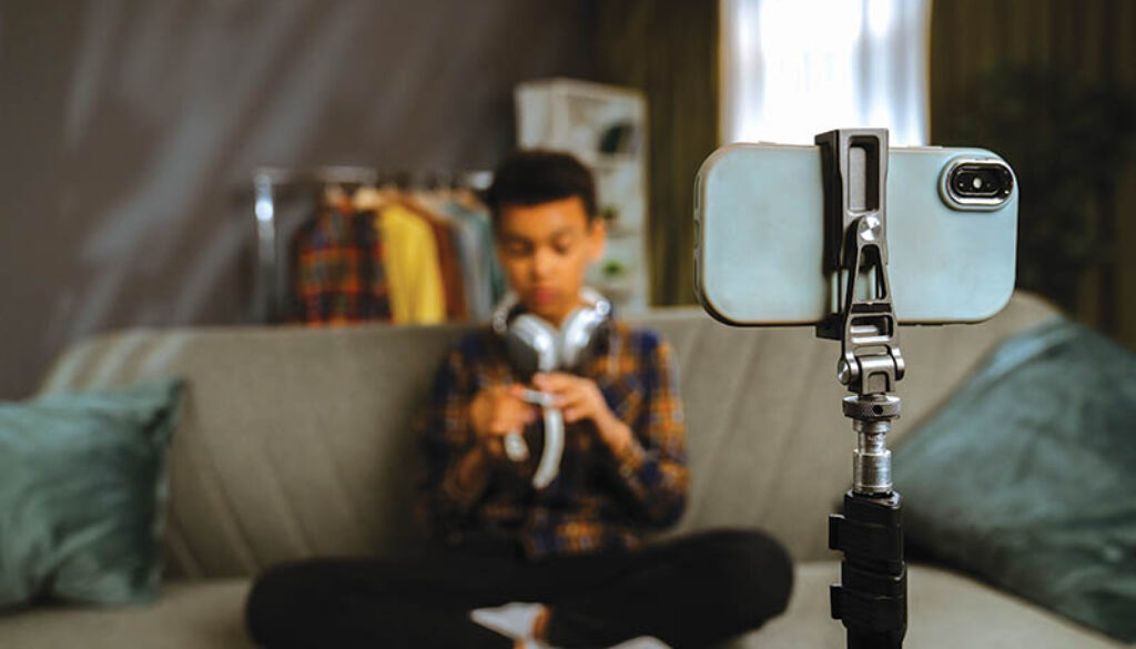 Young Person Recording a Video at Home with Smartphone