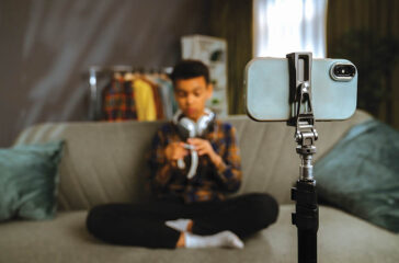 Young Person Recording a Video at Home with Smartphone