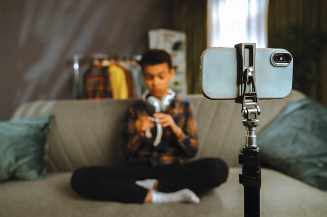 Young Person Recording a Video at Home with Smartphone