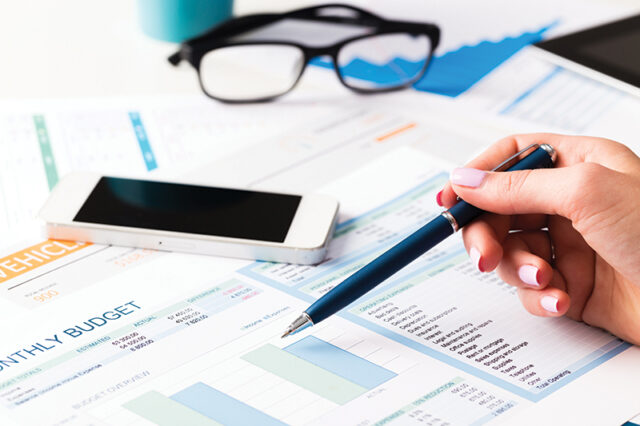 Investment charts business report. Still life in office